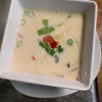 Small Tom Kha Soup · Coconut milk and fresh Thai herb. Mushroom, red onion and tomato.(plz ask for a vegan friend...