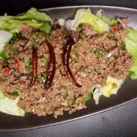 Laab · Ground beef or chicken tossed with Thai herb dressing.