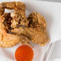 Fish Sauce Wings · Cooked wing of a chicken coated in sauce or seasoning.