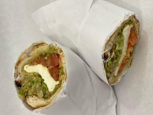 Mozzarella Caprese Melt · Marinated tomatoes, fresh Buffalo mozzarella, nut free pesto, pecorino cheese, imported balsamic, served on a toasted hoagie roll from a local bakery. 