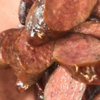 1 lb. Sausage · Smoked Elgin-style beef sausage, including homemade pickles, sweet onions, jalapenos, sauce ...