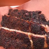 1 lb. Pork Babyback Ribs · Babyback pork ribs by the pound, smoked with a dry rub, includes homemade pickles, sweet oni...