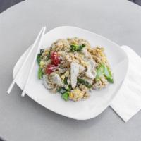 5. Kao Pad · Thai style fried rice with egg, broccoli, peas and carrots 