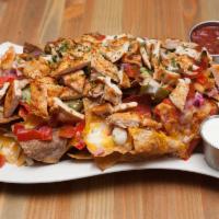 Jackpot Nachos · Crispy tortillas loaded with fresh tomato, jalapeno, scallions, melted cheddar and Jack chee...