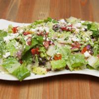 Greek to Me Salad · Crisp romaine lettuce tossed with fresh tomatoes, red onions, cucumbers, black olives, roast...