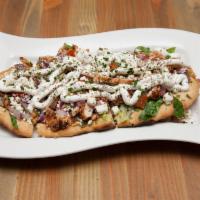 The Gyro Flatbread · Marinated grilled chicken, tzatziki sauce, lettuce, tomato, red onion and feta cheese.