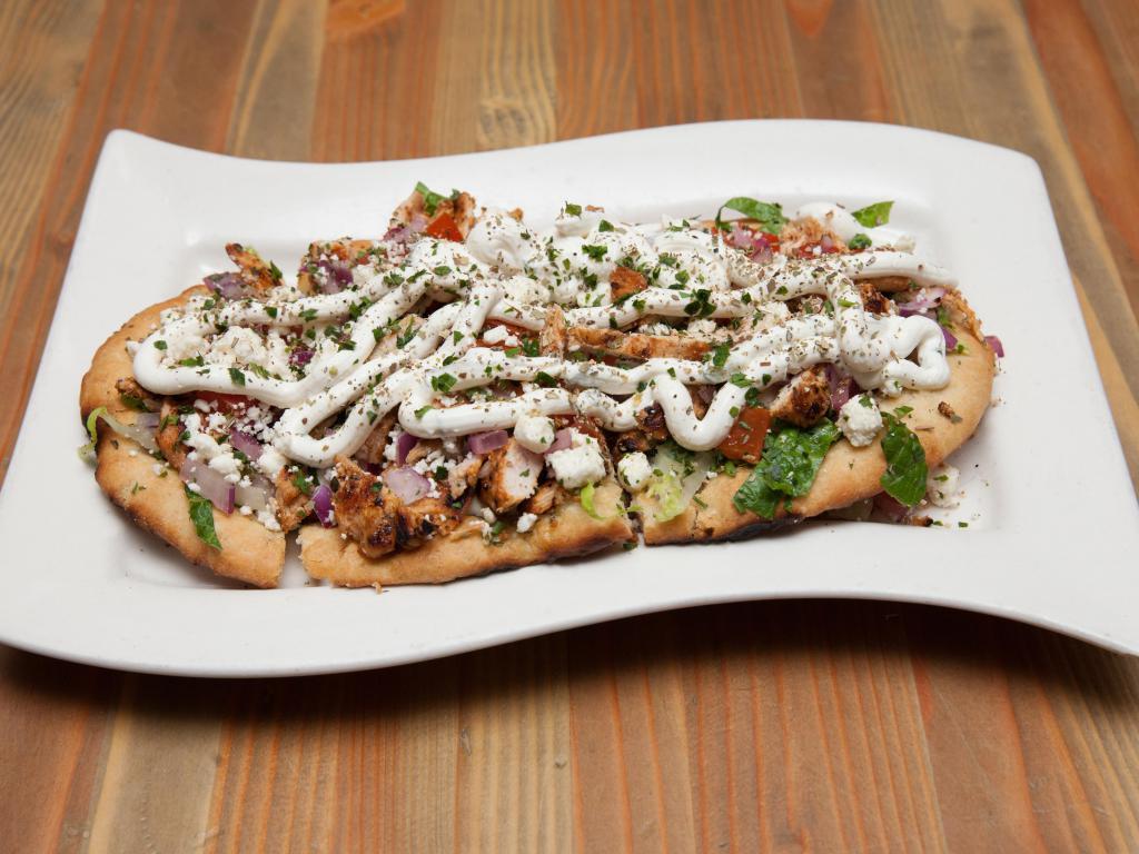 The Gyro Flatbread · Marinated grilled chicken, tzatziki sauce, lettuce, tomato, red onion and feta cheese.