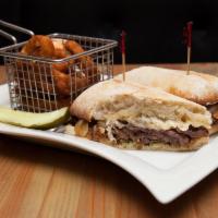 Ace of Steak Sandwich · Marinated skirt steak smothered with caramelized onions, topped with shaved Parmesan on a ci...