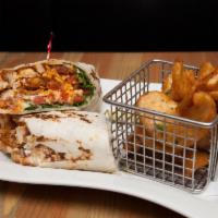Buffalo Chicken Wrap · Crispy fried chicken tossed in Buffalo sauce wrapped in a warm tortilla filled with lettuce,...