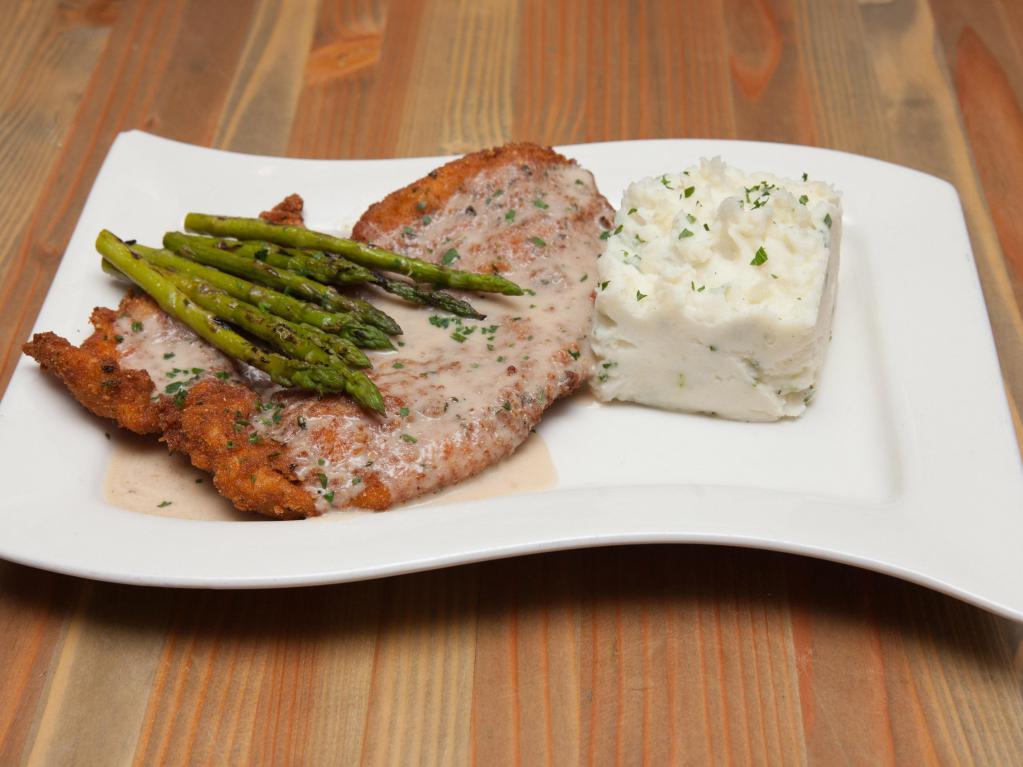 Country Fried Chicken · Hand breaded, pan-fried chicken breast topped with house made country gravy. Served over made from scratch chive mashed potatoes with charred asparagus.
