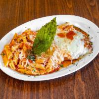 Chicken Parmigiana Dinner · Breaded chicken covered in marinara sauce and topped with mozzarella.