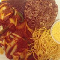 Wakye · Rice and beans cooked with ghanaian spices served with stew of your choice. Vegetarian choice.