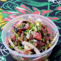 Ahi Tuna · Classic poke tuna marinated with sweet sesame shoyu, green onions, pickled onions, and hijik...