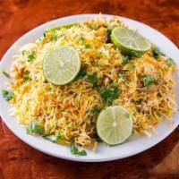 Chicken Biryani · Basmati rice cooked with chicken, spices, and special herbs.