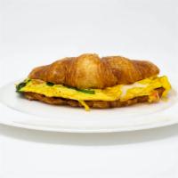 Breakfast Croissant · Freshly scrambled eggs and a slice of provolone cheese served on a flaky and buttery croissa...