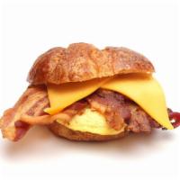 Bacon Breakfast Croissant · Freshly scrambled eggs, crispy bacon and a slice of provolone cheese served on flaky and but...