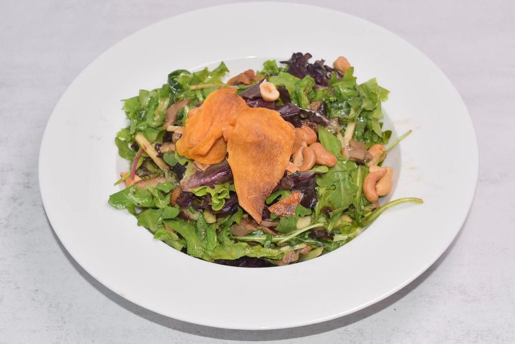 Duck Salad Dinner · Mixed greens topped with duck, prunes, apple, and cashew nuts.