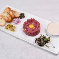 Beef Tartare Dinner · Special sauce, shallot, pickles peppers, and quail eggs.