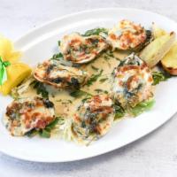 Oysters Rockefeller Dinner · Baked blue point oysters with spinach, bacon, mozzarella cheese, served with toasted bread.
