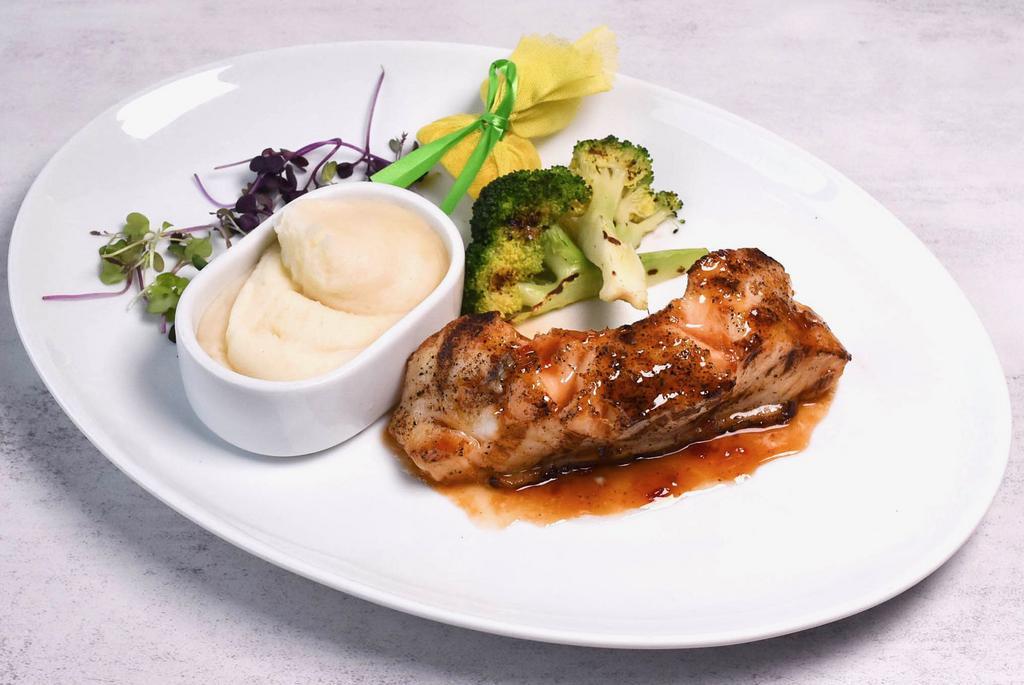 Chilean Sea Bass Dinner · Grilled and glazed fillet of chicken sea bass served with grilled vegetables.