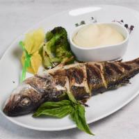 Grilled Branzino Dinner · Whole or fillet of mediterranean branzino served with mashed potatoes and charred broccoli.
