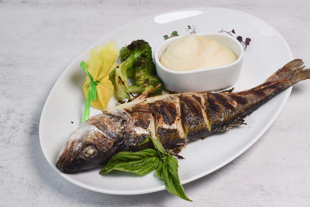 Grilled Branzino Dinner · Whole or fillet of mediterranean branzino served with mashed potatoes and charred broccoli.
