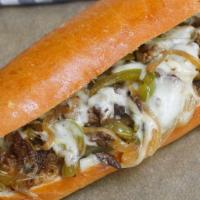 Philly Cheese Steak Sandwich · Grilled roast beef with fried onions, mozzarella & brown gravy.