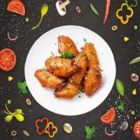 Beyond Wings · Classic bone-in wings oven-baked, cooked to order perfectly crisp, and tossed with your choi...