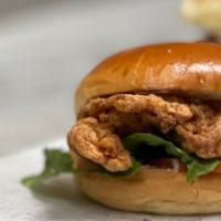 Chicken Inc · Lightly seasoned & breaded fried chicken, lettuce, tomatoes, pickles, and mayo on a brioche ...