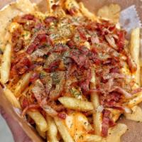 Bacon Fries · Fries loaded with bacon and house sauce.