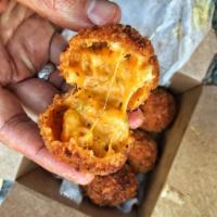 Dynamite Mac · Deep-fried macaroni and cheese jalapeno poppers.