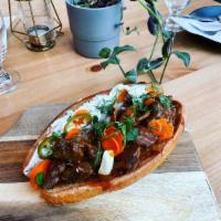 Braised Beef Sandwich · Red gravy, pickled carrot, pickled peppers, dill creme fraiche