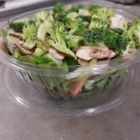 Veggie Delight Salad · Fresh lettuce, tomatoes, cucumbers, onions, peppers, mushrooms, broccoli, and croutons.
