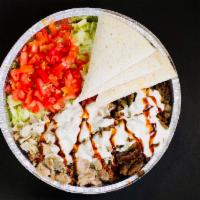 Lamb over Rice · Come with lettuce, tomato, onions and pita bread. Whit sauce hot sauce