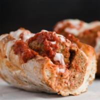 Meatball · Mozzarella, tomato sauce, meatballs, Parmesan. Served on fresh baked bread.