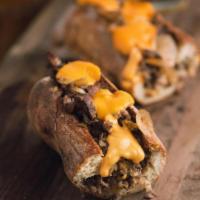 Philly Cheesesteak · Mozzarella, philly steak, caramelized onion and dollops of cheez whiz (can substitute provol...