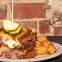 Classic Reuben · Hot corned beef and sauerkraut topped with 1000 island dressing, melted Swiss cheese, served...