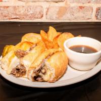 French Dip · Our sliced beef with swiss cheese and sauteed onions along side our delicious au jus