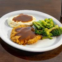 GH CFS · Our succulent country fried steak topped with brown gravy alongside broccoli and mashed pota...