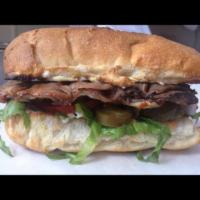 Pastrami Sandwich · Served with lettuce, onion, tomato, pickles, mustard, mayo, mozzarella cheese and Mexican ja...