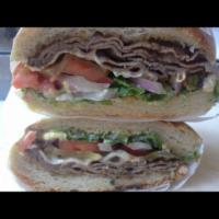 Roast Beef Sandwich · Served with lettuce, onion, tomato, pickles, mustard, mayo, mozzarella cheese and Mexican ja...