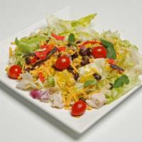 The South Westerner Wrap · Iceberg, grilled chicken, black beans, corn, cilantro, tomatoes, red onions, tortilla strips...