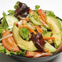 West Coaster Wrap · Mix greens, garbanzo beans, tomatoes, shredded carrots, cucumber and avocado with citrus vin...