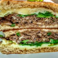 Steak and Cheese Sandwich · Steak, mozzarella cheese, tomatoes, fresh mushrooms, onions, green peppers, lettuce, and cre...