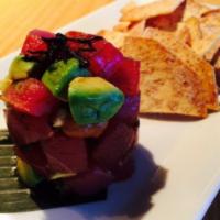 Ahi Tuna Poke · Ahi tuna, macadamia, avocado, scallion and wonton chips. 