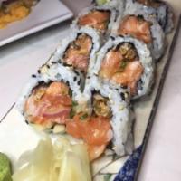 Chipotle Salmon Roll · Salmon, cucumber, salmon skin, red onion and sesame seed.