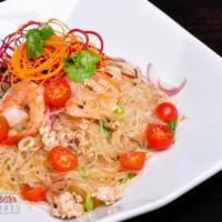 Glass Noodle Salad · Mixed greens, chicken, shrimp, red onion, cilantro, tomato and sweet chilli vinaigrette. Spi...