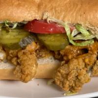 Catfish Po’Boy · Fried catfish Po’boy served with your choice of fried okra or seasoned fries and a water.