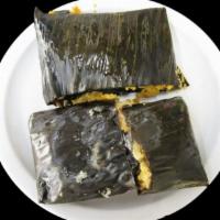 Tamal De Mole · 1 Tamal wrapped in a banana leaf filled with our delicious traditional Oaxacan mole and chic...