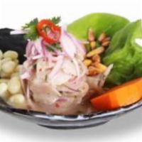 Ceviche De Pescado · Fresh fish and seafood in lime juice mixed with special spices. Served with sweet potato and...